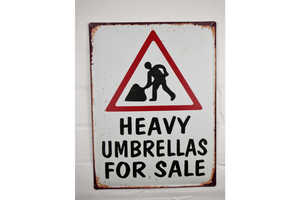 Comical street sign - Huge umbrellas for sale