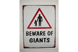 Comical street sign - beware of giants