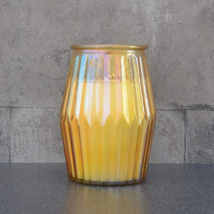 Orange and grapefruit candle in yellow ridged pot
