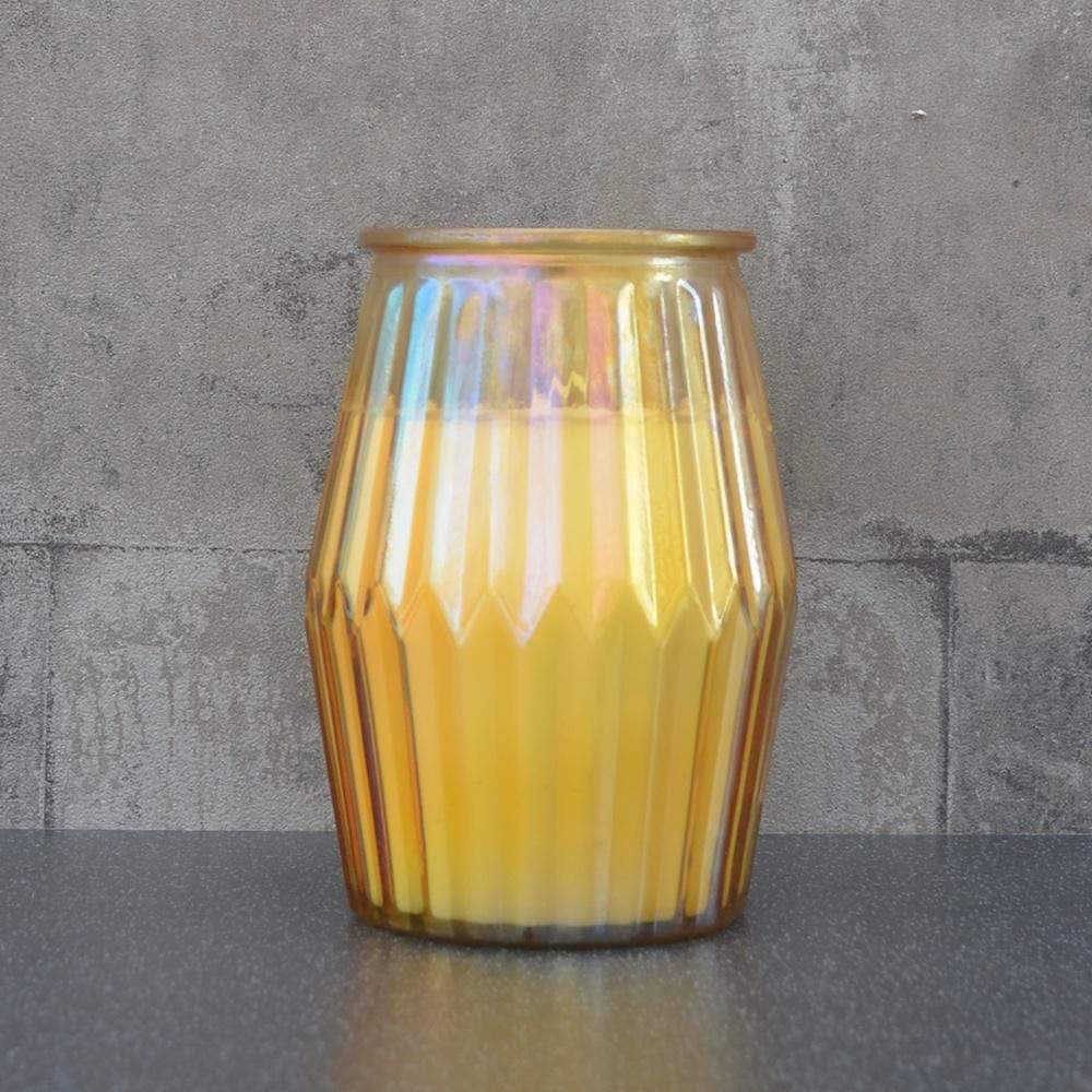 Orange and grapefruit candle in yellow ridged pot