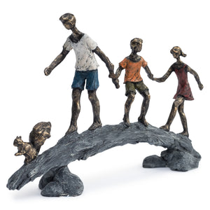 Children on a bridge sculpture