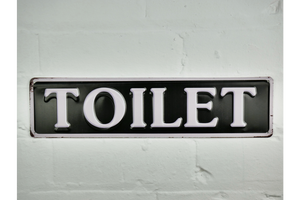 Toilet Sign - black background with white writing